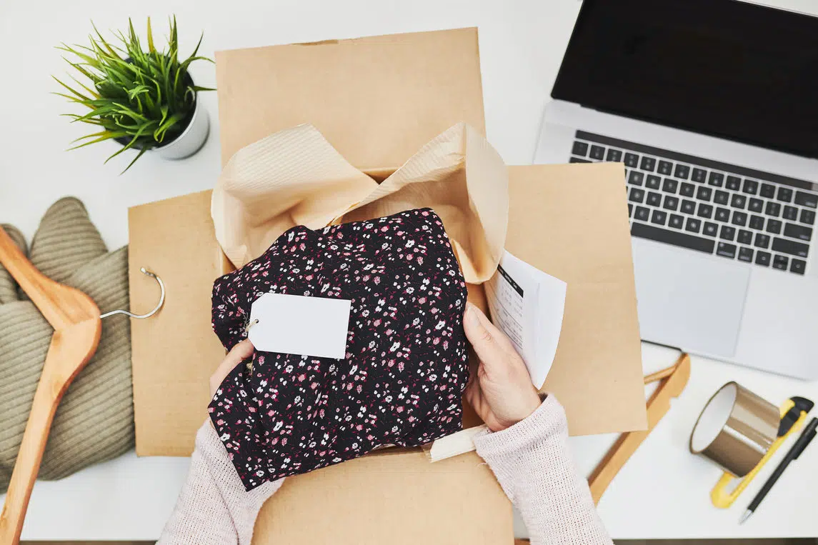 Business owner packing online order to delivery to customer