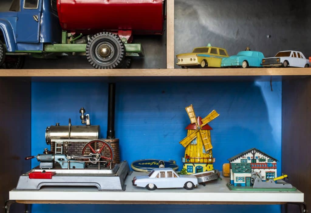 car models and various toys on the shelf