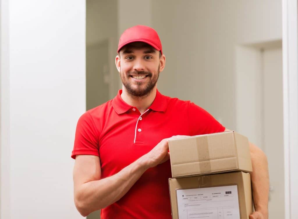 courier waiting to release a package from UK to a US customer